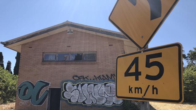 Graffiti and smashed windows at the rundown property. Picture: Supplied