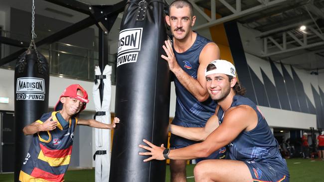 Enzo Cornejo attended Crows training at the Club where he had a chance to meet the AFL team and have a kick of the footy with them. Two of his favourite players, Joshua Rachele and Taylor Walker spent some extra time with the youngster. Picture: Dean Martin