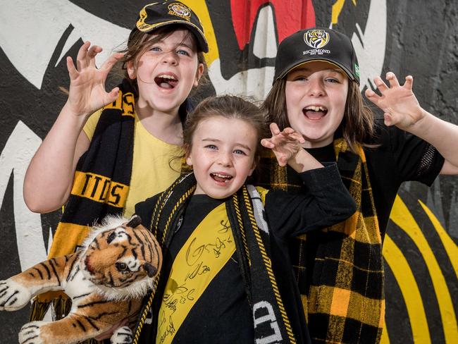 Sisters Ava, Violet and Scarlet at the Punt Rd Oval. Picture: Jake Nowakowski