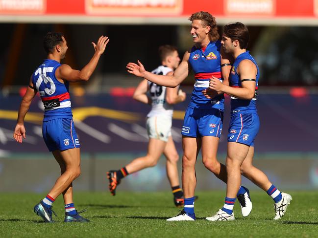 Aaron Naughton celebrates his sixth goal of the match.