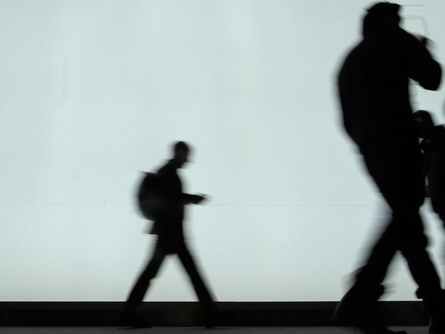 (FILES) This file picture taken on February 27, 2018 shows people walking in front of the ZTE stand at the Mobile World Congress (MWC), the world's biggest mobile fair, in Barcelona.  Chinese telecom giant ZTE halted trading of its shares in Hong Kong and Shenzhen on April 17, 2018 following the announcement of a US ban on its purchase of sensitive technology that drew a pledge from China to "safeguard" its companies if necessary. / AFP PHOTO / Lluis GENE