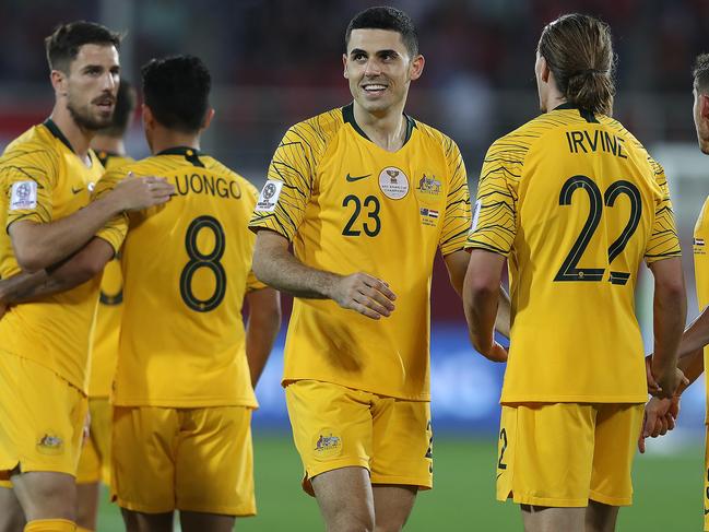 AL AIN, UNITED ARAB EMIRATES - JANUARY 15:  Tomas Rogic (C) celebrates his sides second goal with Jackson Irvine and Mark Milligan during the AFC Asian Cup Group B match between Australia and Syria at Khalifa Bin Zayed Stadium on January 15, 2019 in Al Ain, United Arab Emirates. (Photo by Francois Nel/Getty Images)