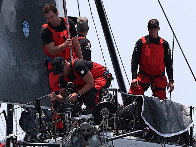 Photo taken on December 26, 2019 shows Hong Kong Dovell 100 yacht SHK Scallywag sailing out of Sydney harbour at the start of the Sydney to Hobart yacht race. (Photo by GLENN NICHOLLS / AFP) / -- IMAGE RESTRICTED TO EDITORIAL USE - STRICTLY NO COMMERCIAL USE --