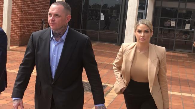 Monstr Clothing founder and accused bikie Shane Ross leaving Campbelltown Court today with his wife.