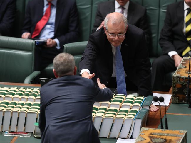 The Prime Minister and Opposition Leader shake hands during Question Time in the House of Representatives on Monday. Picture: Kym Smith