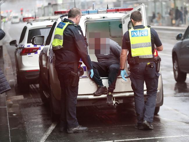 The man was arrested outside Flinders St Station. Picture: David Crosling