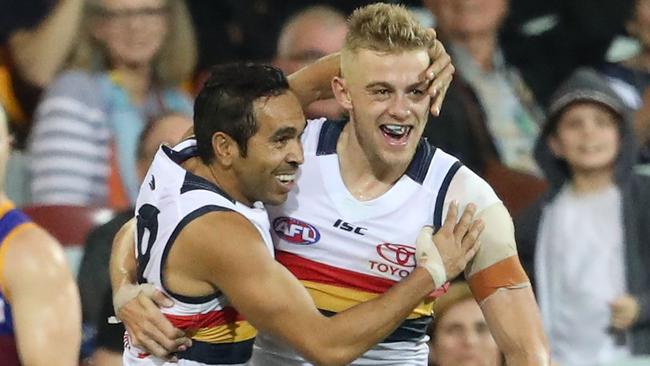 Hugh Greenwood celebrates one of his three goals on debut with teammate Eddie Betts. Picture: Scott Barbour (Getty).