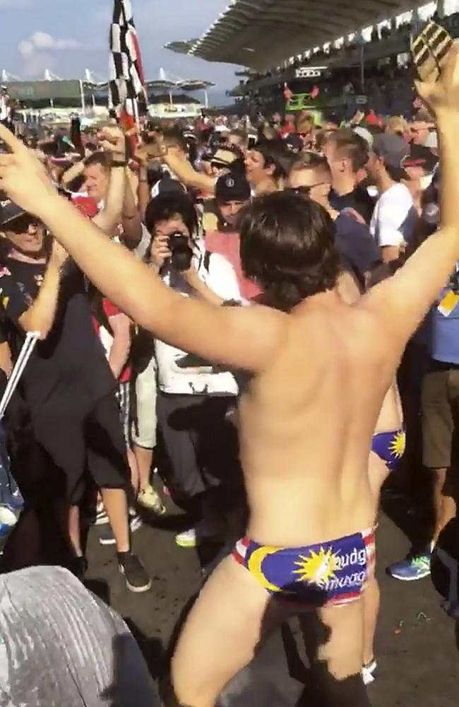 One of the Budgie Nine poses for photographers at the Grand Prix. Picture: Channel 10