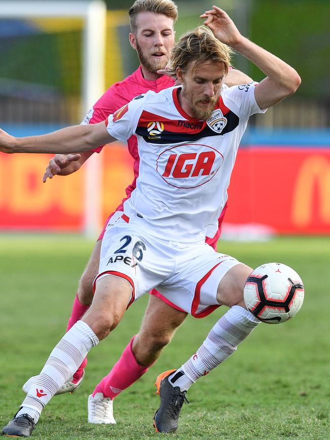 Ben Halloran of United outmanoeuvres Mariner Andrew Hoole. Picture: AAP Image/Brendan Esposito