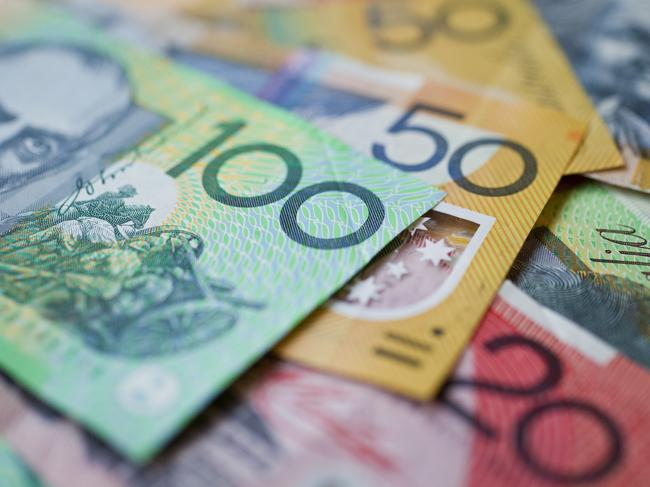 Australian money background showing $100, $50 and $20 notes with a shallow depth of field.