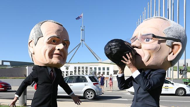 caricatures of Bill Shorten and PM Scott Morrison with people attending a Stop Adani rally on the lawns of Parliament House in Canberra. Picture Kym Smith