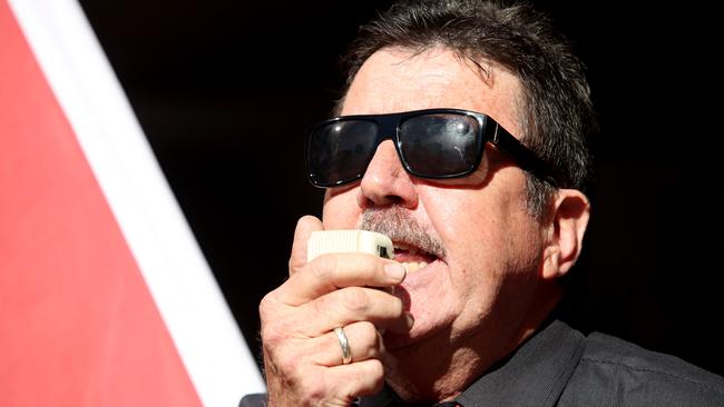 Australian Education Union (AEU) President Howard Spreadbury speaks to members during a rally outside the Department of Education building in Adelaide. (AAP Image/Kelly Barnes) NO ARCHIVING