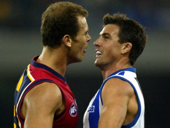 Wayne Carey and Anthony Stevens clash during a Crows match against the Kangaroos after the affair was revealed.