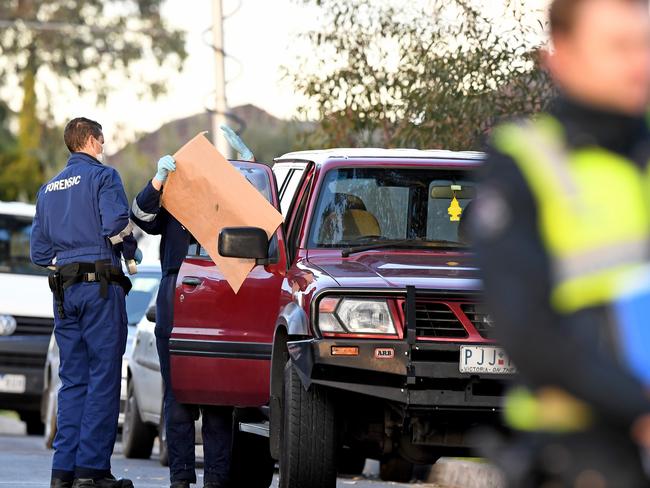 Victoria police forensics examine the area where a red Nissan Patrol belonging to Paul Costa was found. Picture: AAP Image/Joe Castro
