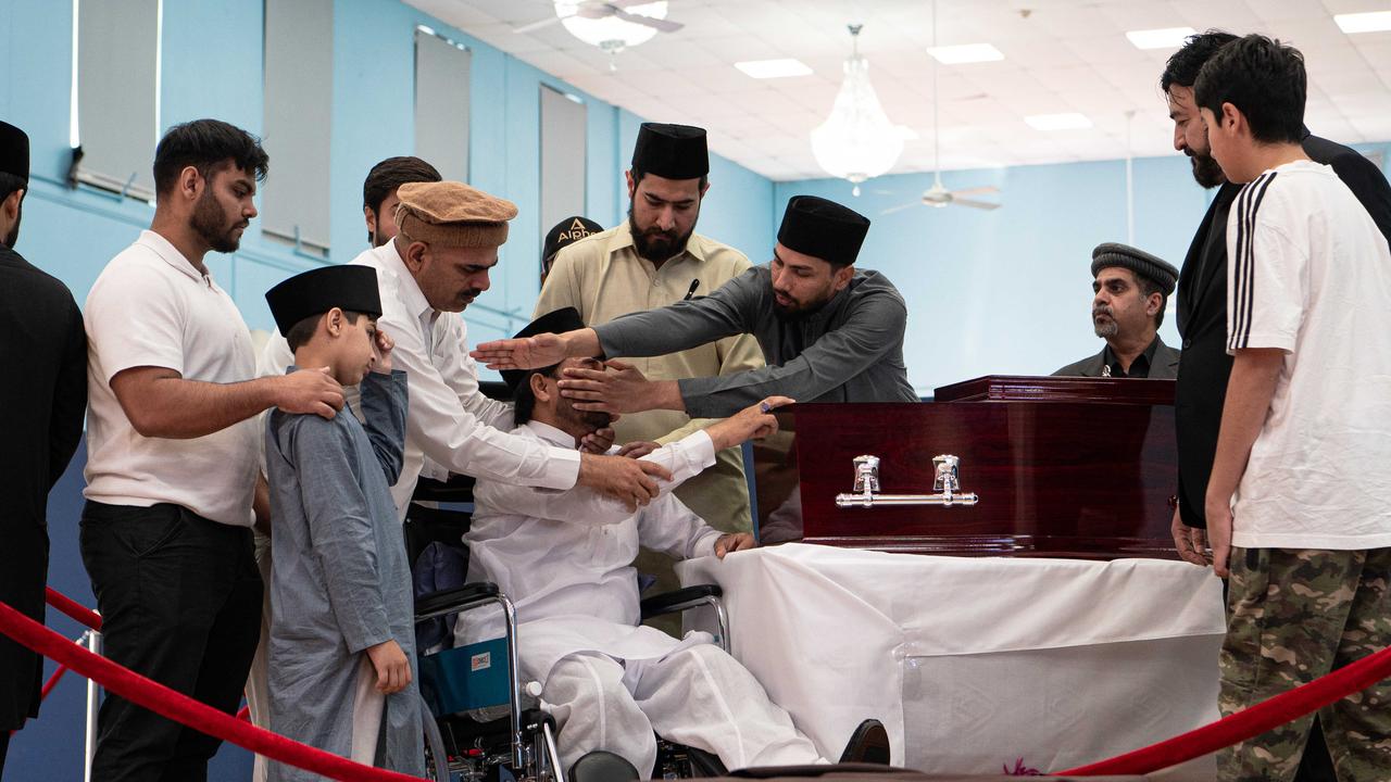 Mr Tahir’s brothers view his body at a mosque in western Sydney. Picture: NCA NewsWire / Flavio Brancaleone