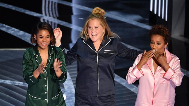 Chris Rock’s barb stood in contrast to the relatively benign humor in the rest of the telecast and from its three hosts, Regina Hall, Amy Schumer and Wanda Sykes