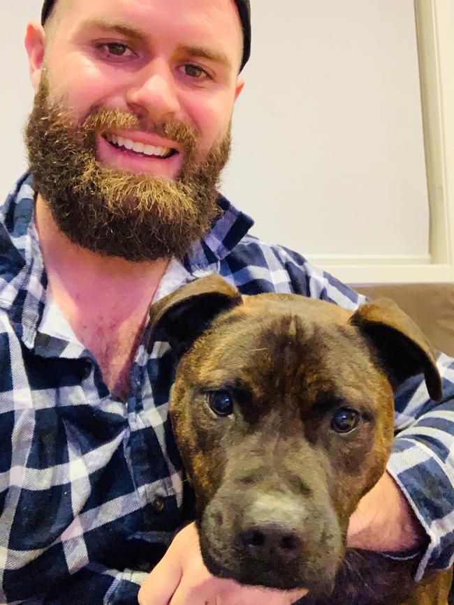 Middleton Grange resident Jason Golban with his staffy Bear. Picture: Supplied