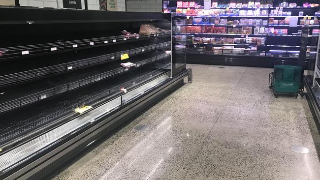 Meat section of Woolworths Ascot, Woolworths closed early on Wednesday night to restock shelves. Photographer: Liam Kidston