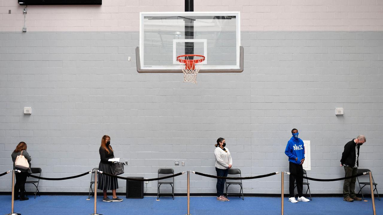 People wait in line to receive a dose of the Moderna COVID-19 vaccine in Los Angeles, California. Picture: Patrick T Fallon/AFP