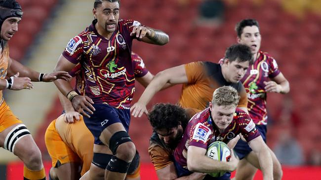 Bryce Hegartyis crunched by the Jaguares defence. Picture: AAP Image/Regi Varghese