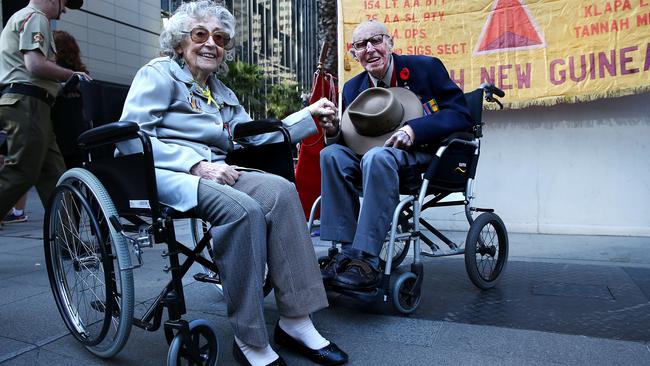 Anzac Day Valerie Ireland, 96, and Albert Maurice Collins, 105, share a laugh before marching in Sydney on Sunday. Picture: Jane Dempster