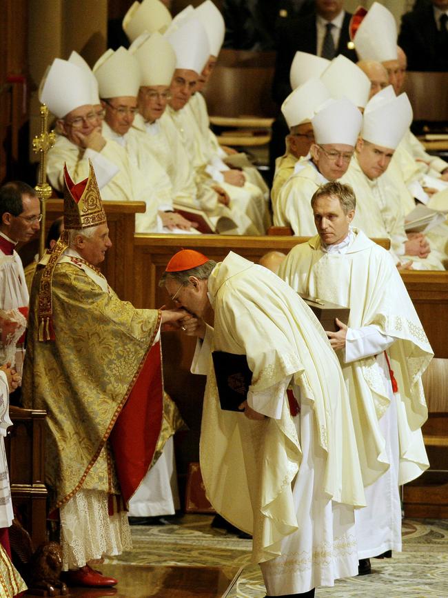 Pope Benedict XVI, left, has his hand kissed by Cardinal George Pell, in 2008.