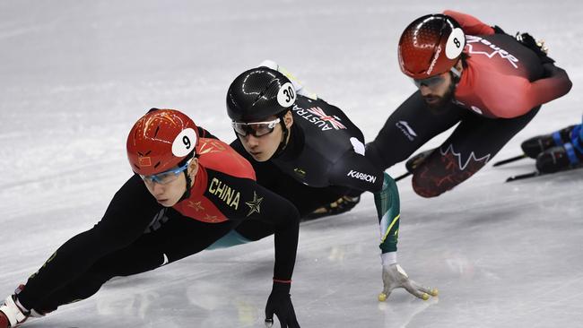 China's Tianyu Han leads Australia's Andy Jung and Canada's Charles Hamelin.