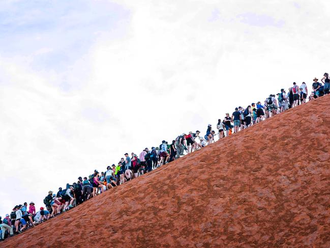 Climbers heading up Uluru in Uluru-Kata Tjuta National Park on one of the last days before the climb closes on October 26.