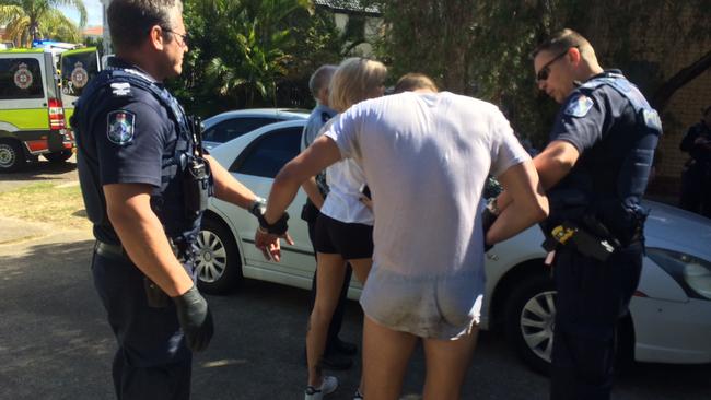 Police help an overdose victim found wildly hallucinating at Mermaid Waters.