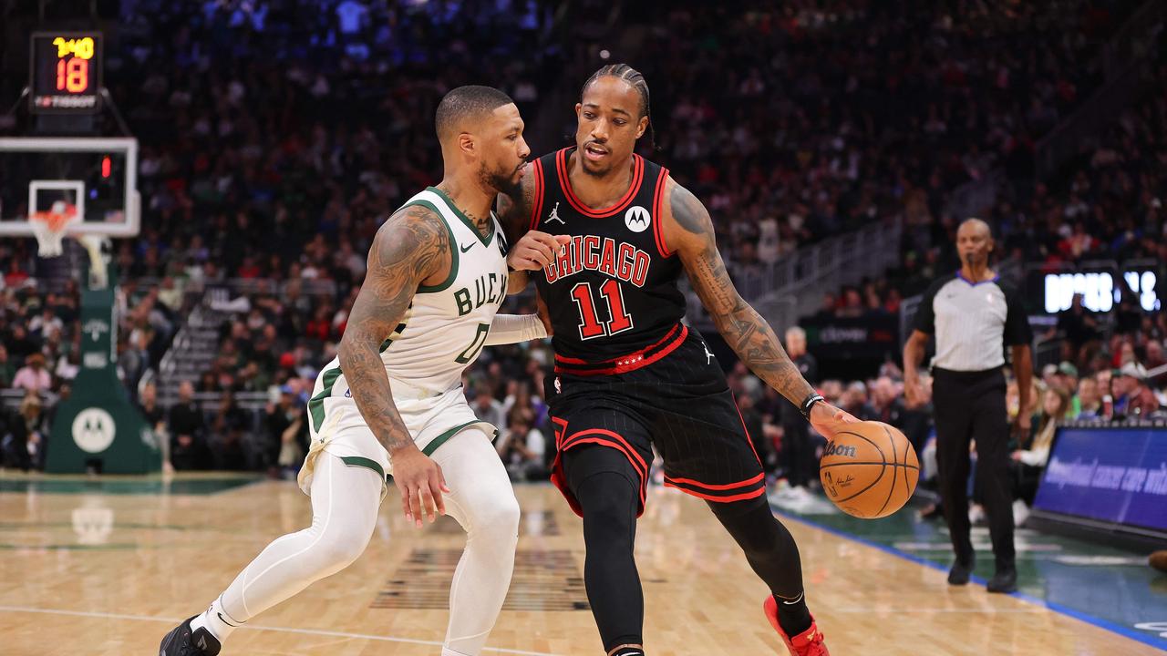 MILWAUKEE, WISCONSIN - NOVEMBER 13: DeMar DeRozan #11 of the Chicago Bulls is defended by Damian Lillard #0 of the Milwaukee Bucks during the first half of a game at Fiserv Forum on November 13, 2023 in Milwaukee, Wisconsin. NOTE TO USER: User expressly acknowledges and agrees that, by downloading and or using this photograph, User is consenting to the terms and conditions of the Getty Images License Agreement. Stacy Revere/Getty Images/AFP (Photo by Stacy Revere / GETTY IMAGES NORTH AMERICA / Getty Images via AFP)