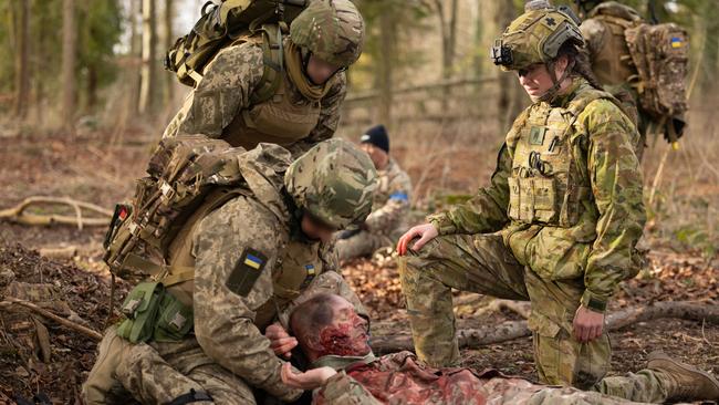 Ukrainian trainees receive valuable first-aid and casualty handling lessons from Australian Army medical personnel deployed on the first rotation of Operation Kudu in the United Kingdom.  Note: Simulated casualty *** Local Caption *** Australia continues to stand with the people of Ukraine, and is providing ongoing support in response to Russiaâs continuing violation of international law.  Having arrived the United Kingdom in January 2023, a contingent of up to 70 ADF personnel have joined partner nations in the UK-led and based training programme for Ukrainian recruits.