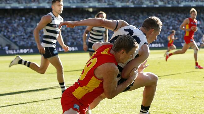 Mitch Duncan in the moments before hitting his head on the ground in a tackle. Picture: Darrian Traynor/AFL Photos