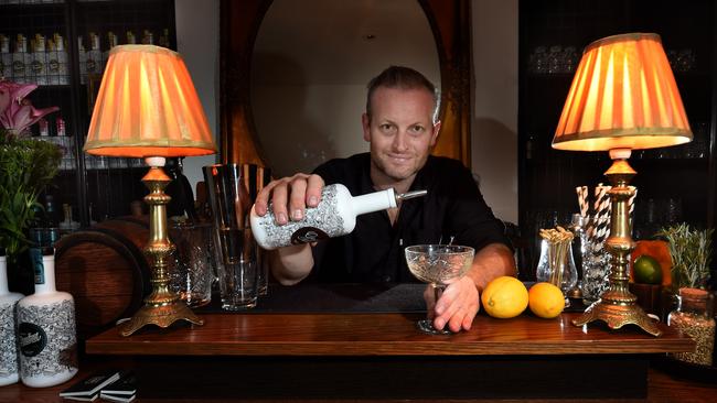 Brad Wilson prepares a gin and tonic with the gin he’s made at Little Lon — one of the smallest gin distilleries in Melbourne’s CBD. Picture: Tony Gough