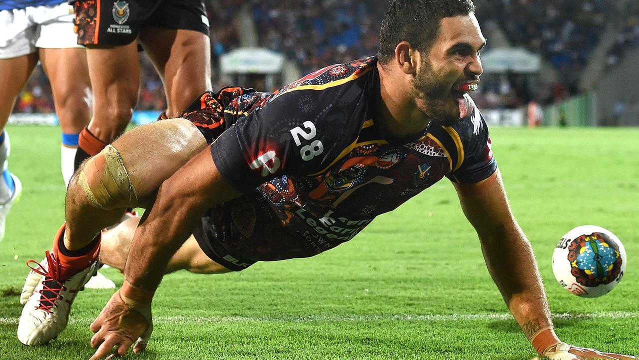 Pulling out the goanna crawl became a trademark of rugby league star Greg Inglis. He famously brought it out after scoring the final try in South Sydney’s grand final win over the Bulldogs in 2014, and this effort was just as impressive. Playing for the Indigenous All-Stars in 2015, Inglis knew there was only one way to celebrate when he touched down for a four pointer. Picture: AAP Image/Dave Hunt.