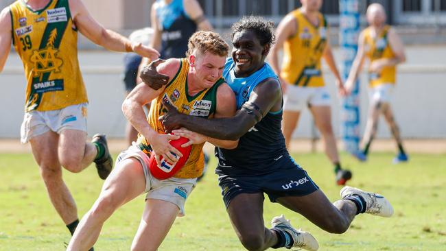 St Mary's Seth Harris is tackled by Antonio James from the Darwin Buffaloes in Round 18 of the 2023-24 NTFL season. Picture: Celina Whan / AFLNT Media