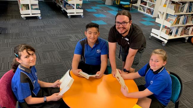 Burrowes State School high achieving: year 5 students Alicia Caldwell, Austin Luamanuuae and Taylor Kelly with teacher Aaron Beckett.