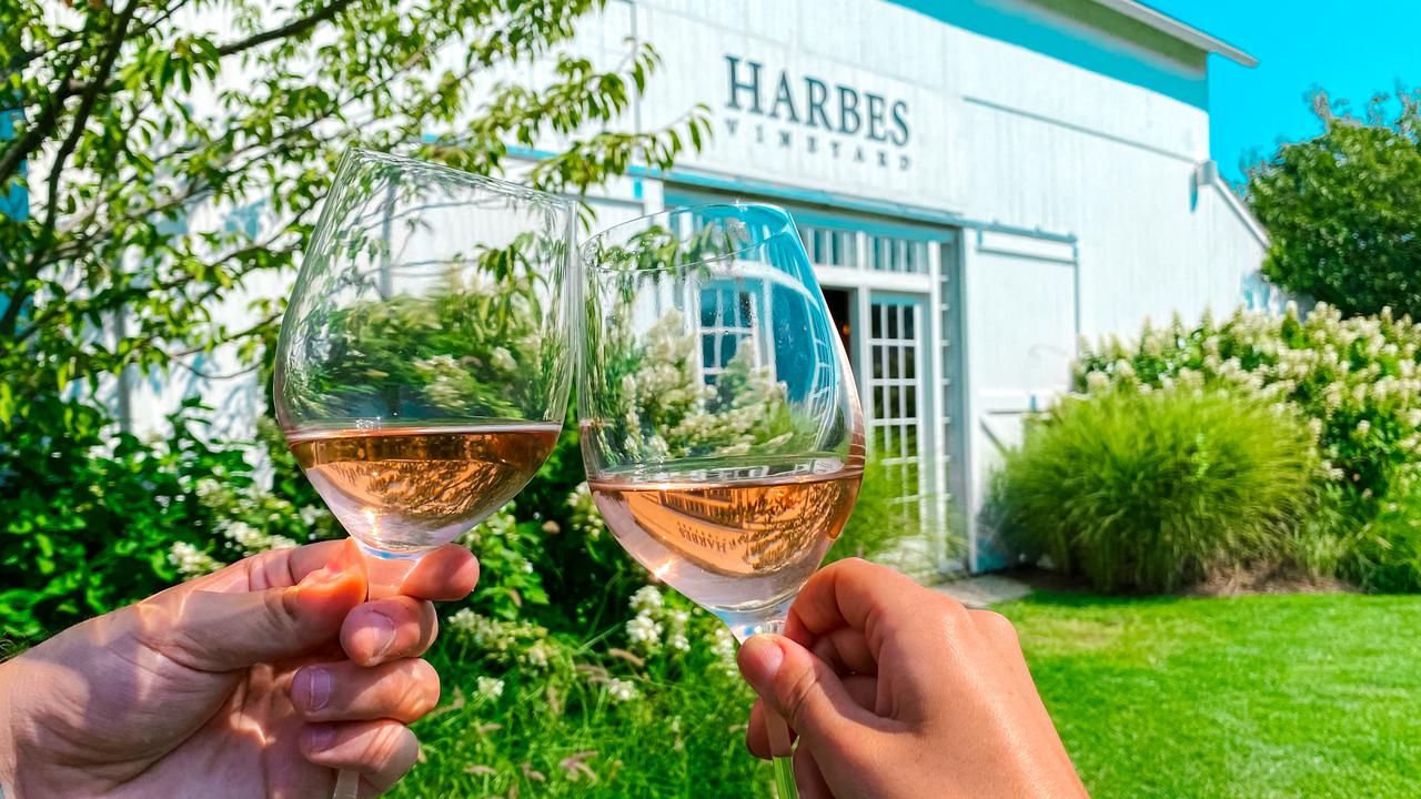 At Harbes Family Farm, you can grab yourself a glass of wine or even an apple cider doughnut.