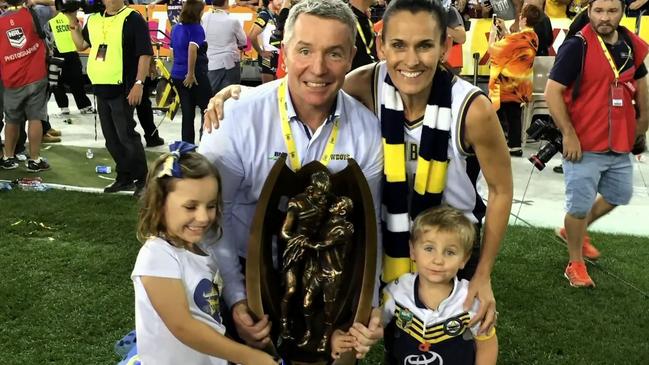 Paul Green celebrates the Cowboys’ historic premiership win in 2015 with wife Amanda and their two young children.