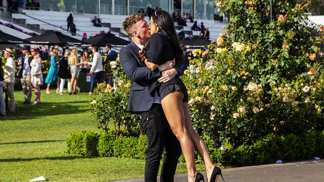 … or interrupting this moment of intense passion – two people clearly overcome by the thrill of watching … horses race. Picture: Jenny Evans/Getty Images