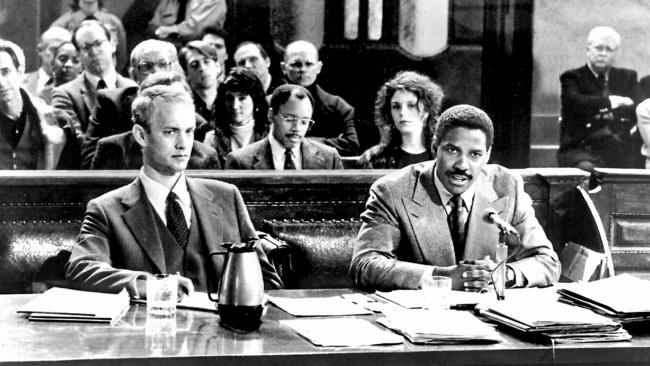 Actor Tom Hanks with Denzel Washington in scene from film Philadelphia.