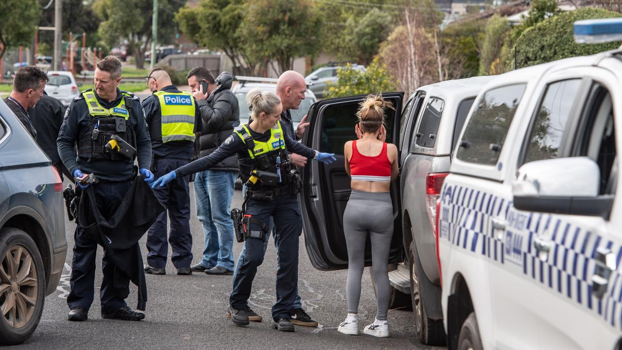 A woman is arrested in Enrob Court, Grovedale after a police car chase. Picture: Brad Fleet