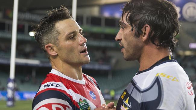 Cooper Cronk of the Roosters and Johnathan Thurston of the Cowboys hug after the match during the Round 21 NRL match between the Sydney Roosters and the North Queensland Cowboys at Allianz Stadium in Sydney, Saturday, August 4, 2018. (AAP Image/Craig Golding) NO ARCHIVING, EDITORIAL USE ONLY