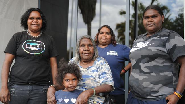 Enid Young (seated) outside the Alice Springs Supreme Court with her granddaughters Leocardia Young, Jodie Young, Monica Young and great great granddaughter Rebecca