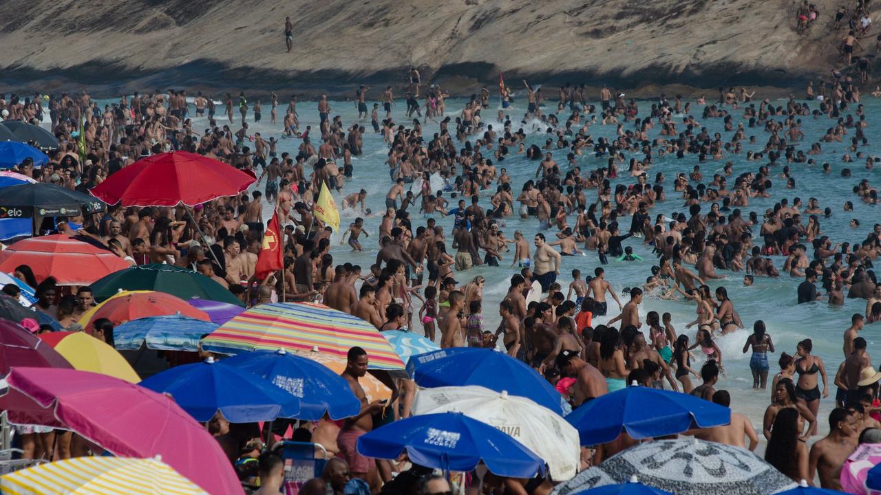 People cool off on the Recreio dos Bandeirantes beach during a heatwave in Rio de Janeiro, Brazil on November 15. Picture: Tercio Teixeira / AFP