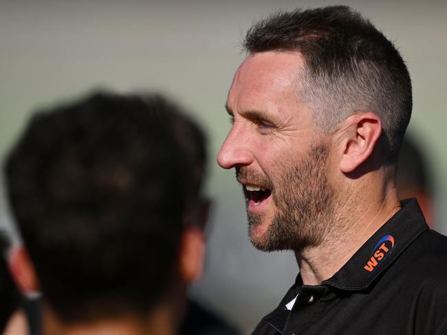 MELBOURNE, AUSTRALIA - SEPTEMBER 24: Werribee head coach Michael Barlow speaks to players during the 2023 VFL Grand Final match between the Gold Coast SUNS and the Werribee Tigers at IKON Park on September 24, 2023 in Melbourne, Australia. (Photo by Morgan Hancock/AFL Photos via Getty Images)