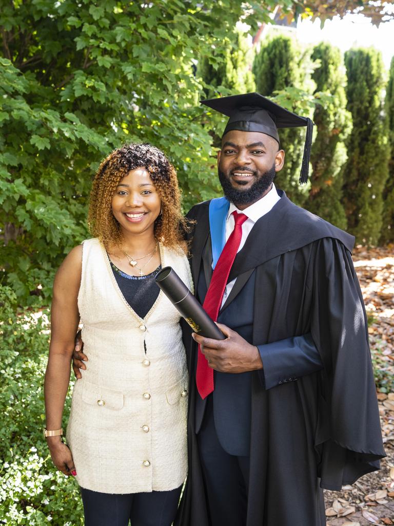 Bachelor of Nursing graduate Ghislain Mutamba celebrates with Labelle Mayangi at the UniSQ graduation ceremony at Empire Theatres, Wednesday, December 14, 2022.