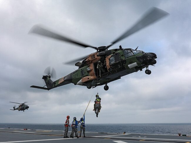 Aviation Support trainees practice winching operations with HMAS Adelaide's embarked MRH-90 helicopter, Poseidon 29. Picture: Royal Australian Navy