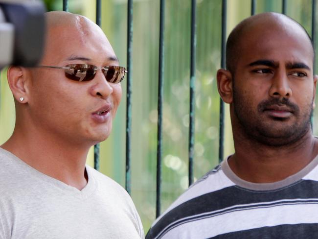 FILE - In this Wednesday, Aug. 17, 2011 file photo, Australian death-row prisoners Myuran Sukumaran, right and Andrew Chan, left, stand in front of their cell during an Indonesian Independence Day celebration at Kerobokan prison in Bali, Indonesia. Indonesia's President Joko Widodo rejected the clemency request from Chan on Jan. 17, 2015, paving the way for his execution along with Sukumaran, his alleged co-ringleader, whose clemency request was already denied Dec. 30. Chan and Sukumaran are among nine Australians who were arrested in 2005 on charges of attempting to smuggle 8.3 kilograms (18.3 pounds) of heroin to Australia from Bali. (AP Photo/Firdia Lisnawati, File)