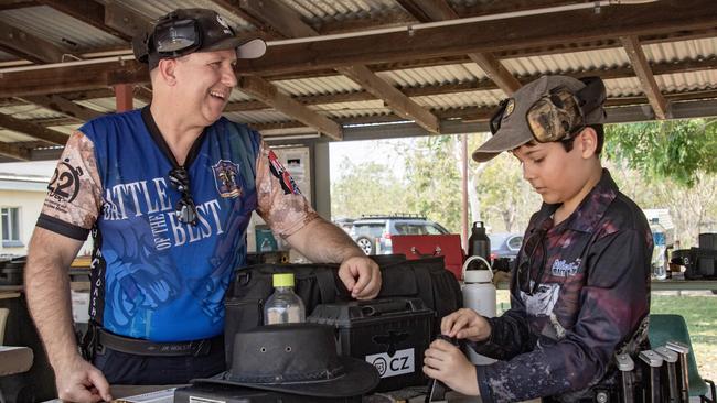 Quinn Coates-Marnane, 12, and his stepdad Zac Sarnecki bond over a shared love of International Practical Shooting, a sport that combines obstacle courses with target shooting. Image by Brian Cassey