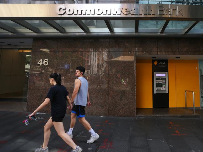 SYDNEY, AUSTRALIA - FEBRUARY 26: Pedestrians walk past a Commonwealth Bank of Australia (CBA) branch on February 26, 2024 in Sydney, Australia. Commonwealth Bank's latest financial results reveal a robust performance, with the bank reporting a record profit of $9.6 billion for the 2022-23 fiscal year, underscoring its position as Australia's largest and most profitable lender. The strong earnings were driven by solid loan growth, improved margins, and a focus on cost control, positioning the bank for continued success in a challenging economic environment. (Photo by Lisa Maree Williams/Getty Images)